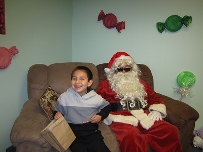 A child sitting with Santa